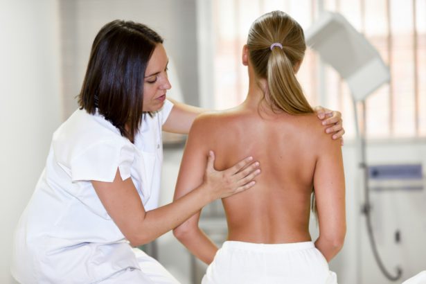 Medical check at the shoulder in a physiotherapy center.