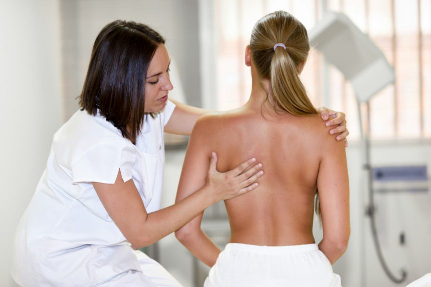 Medical check at the shoulder in a physiotherapy center.