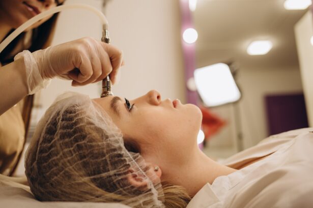 The cosmetologist makes the procedure Microdermabrasion of the facial skin of a beautiful,