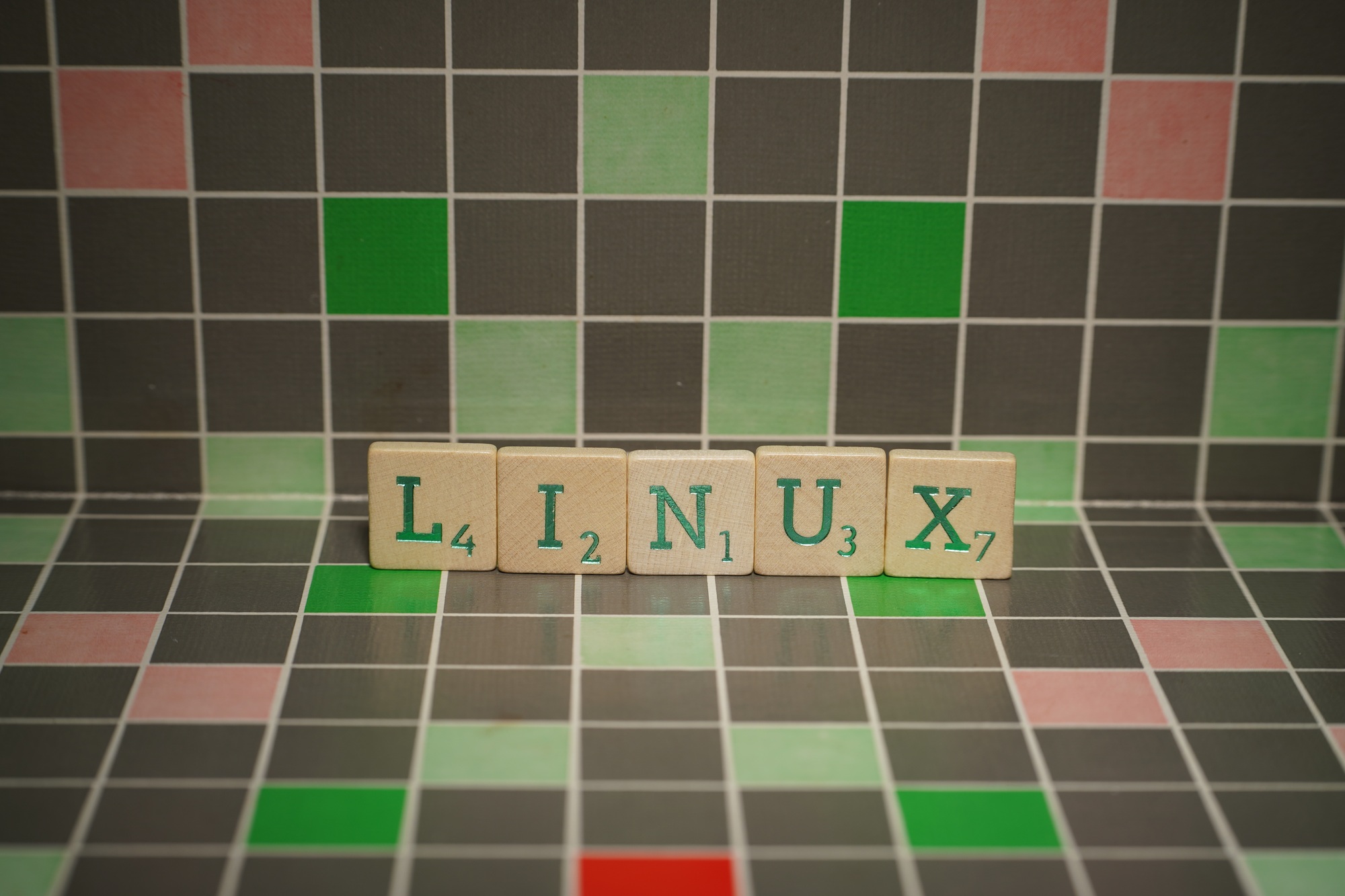 Tile with green linux text on a blocked background