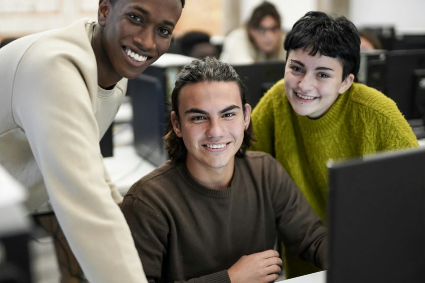 Young students smiling on camera - Technology and business class